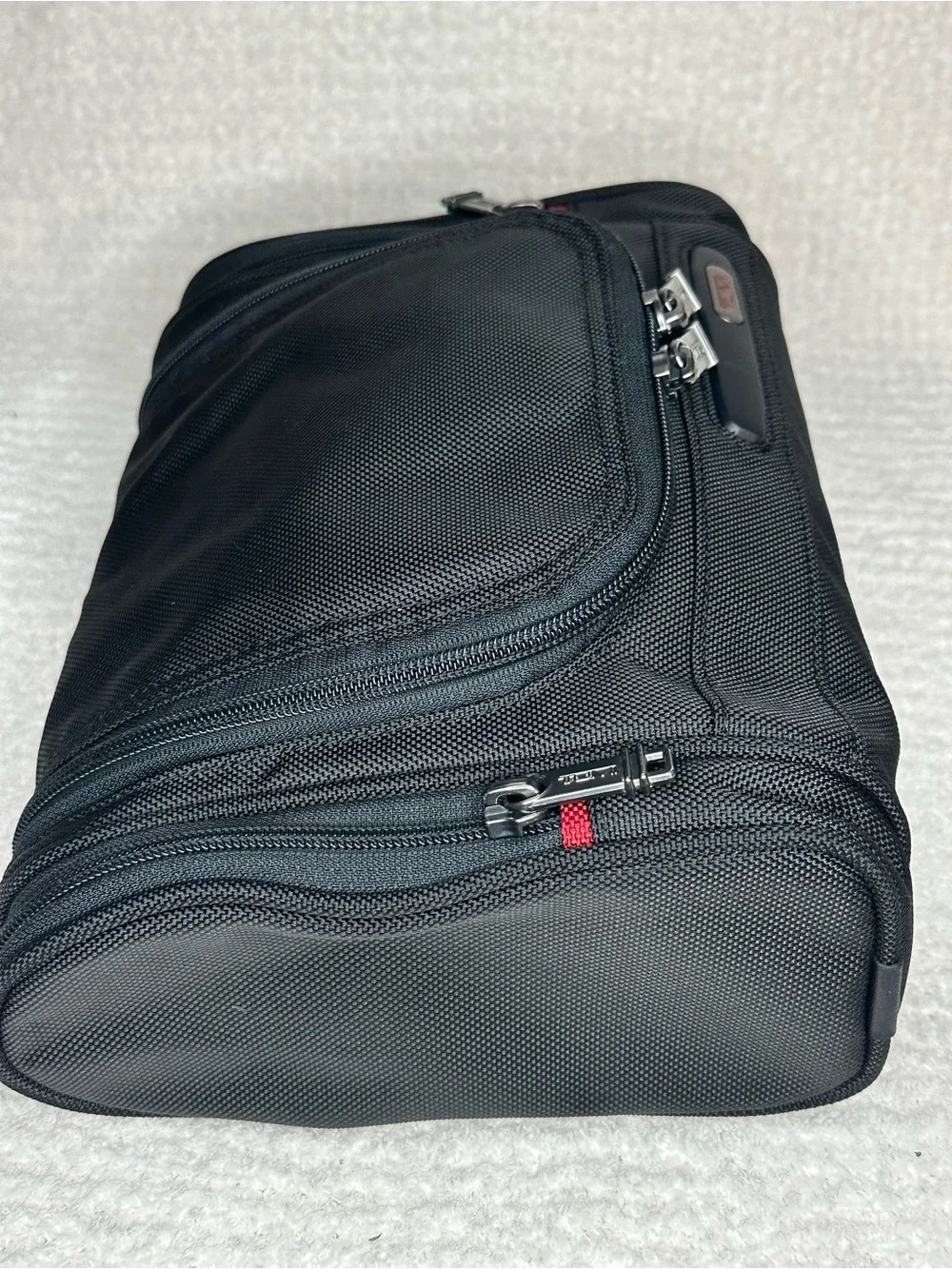Tumi Black Toiletry Bag with Red Accents